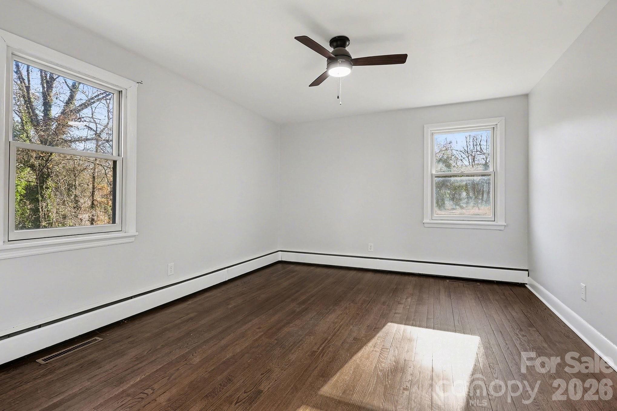 225 Valleyview Place Salisbury, NC 28144 - Photo 15 of 36 a view of a big room with wooden floor and windows