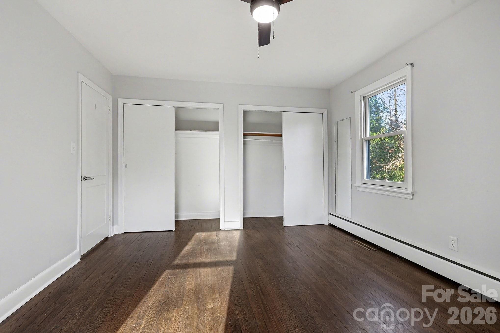 225 Valleyview Place Salisbury, NC 28144 - Photo 16 of 36 a view of an empty room with window and wooden floor