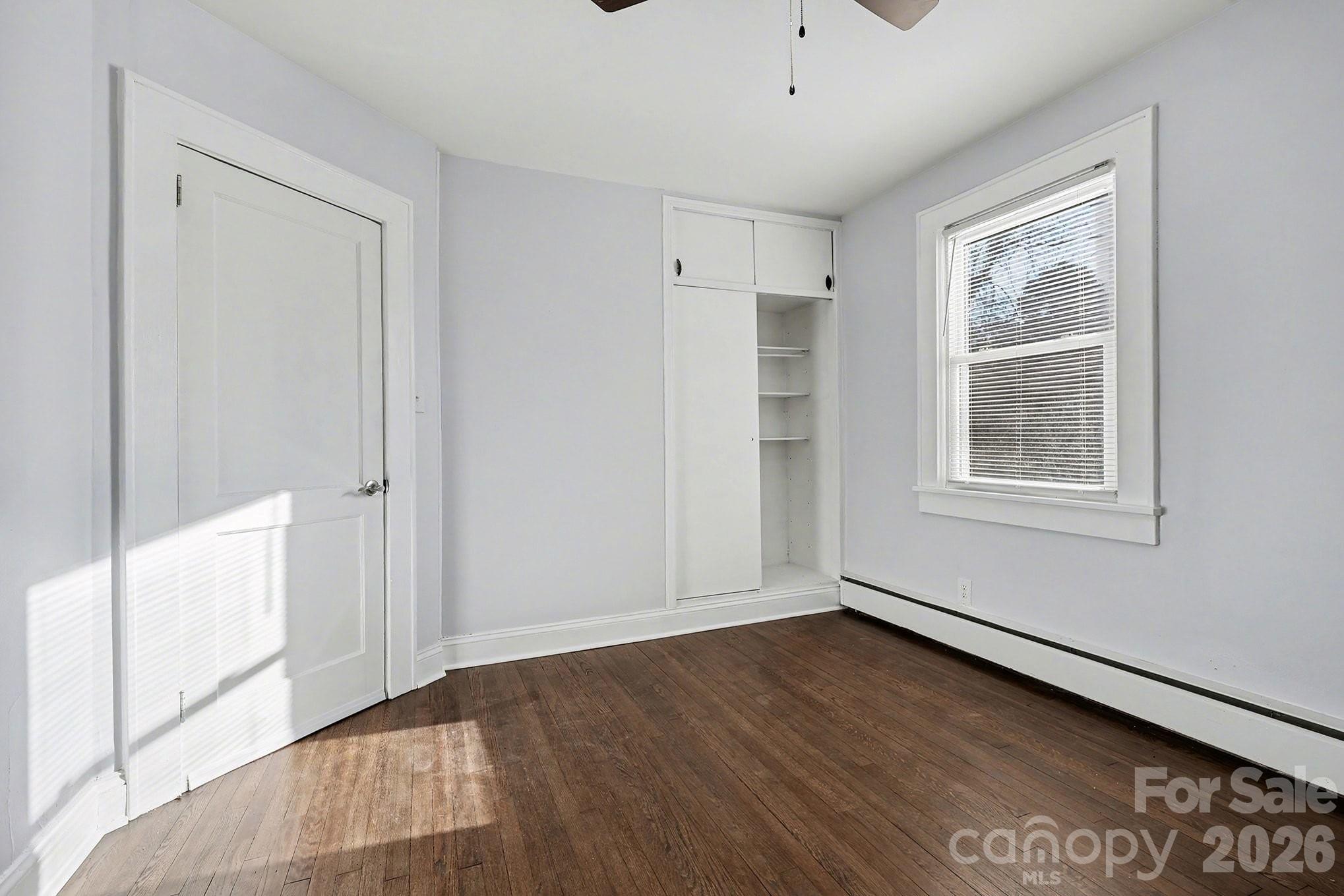 225 Valleyview Place Salisbury, NC 28144 - Photo 20 of 36 a view of empty room with wooden floor and fan