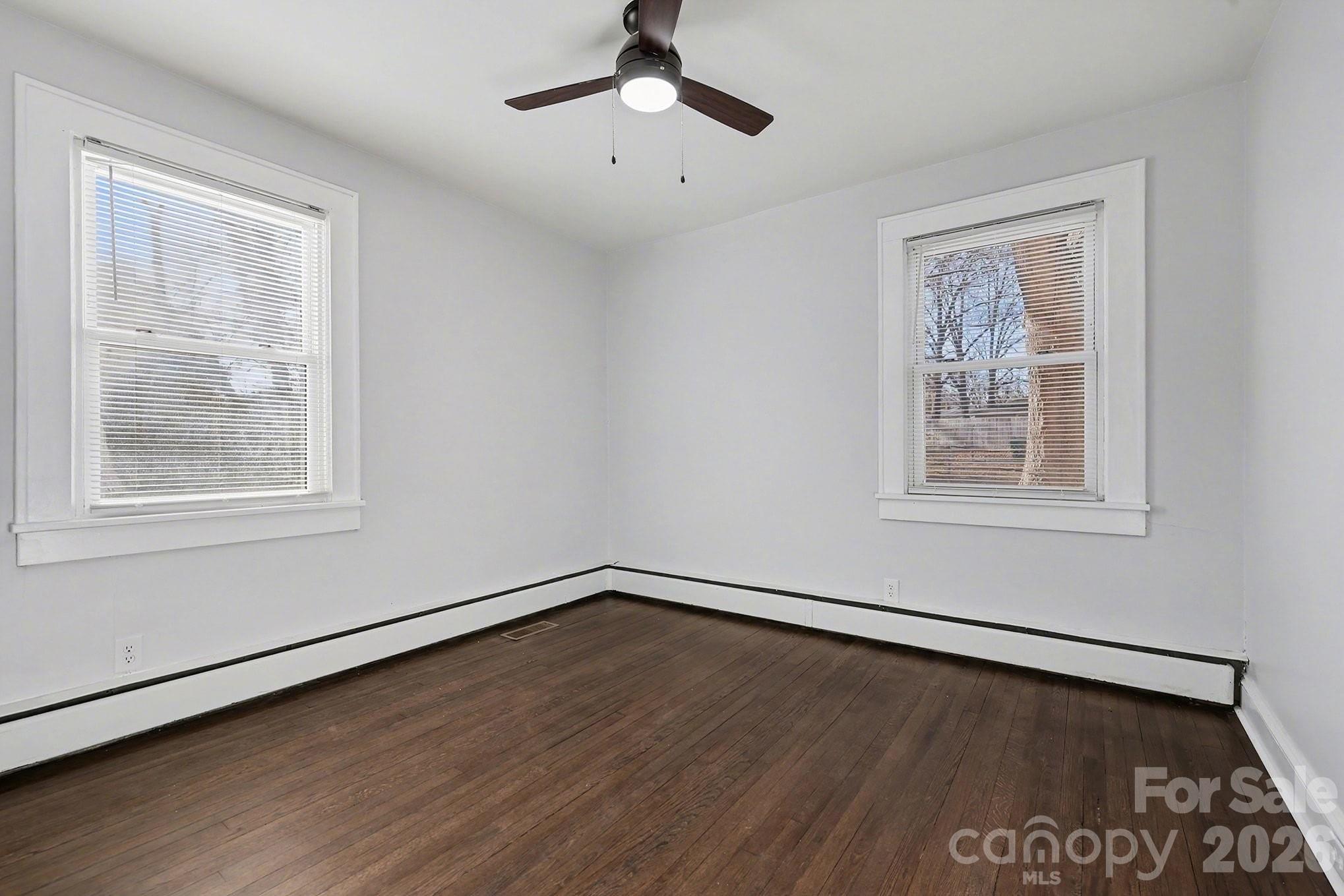 225 Valleyview Place Salisbury, NC 28144 - Photo 21 of 36 a view of an empty room with wooden floor and a window