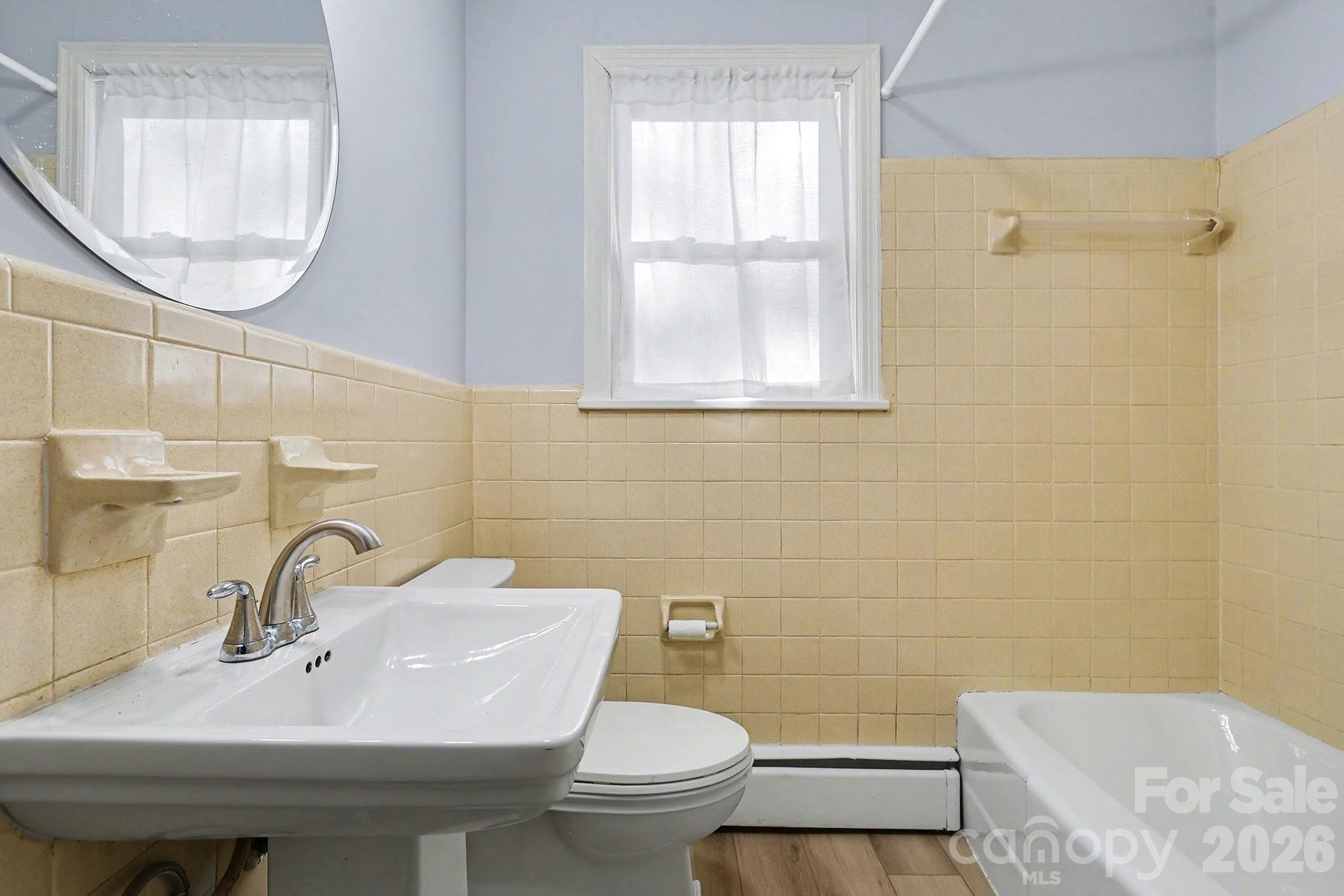 225 Valleyview Place Salisbury, NC 28144 - Photo 22 of 36 a bathroom with a sink a toilet and a mirror