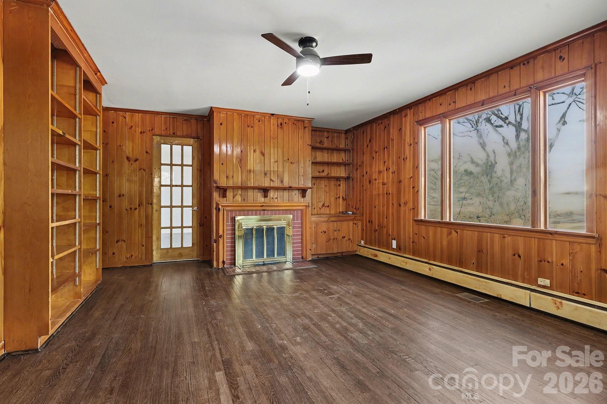 225 Valleyview Place Salisbury, NC 28144 - Photo 24 of 36 a view of an empty room with a window and wooden floor