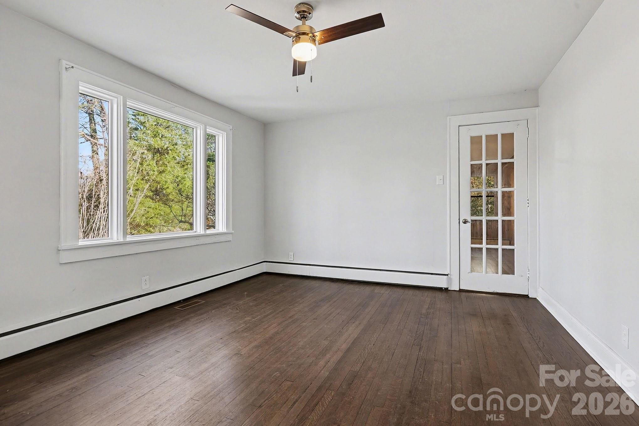 225 Valleyview Place Salisbury, NC 28144 - Photo 4 of 36 a view of an empty room with wooden floor and a window