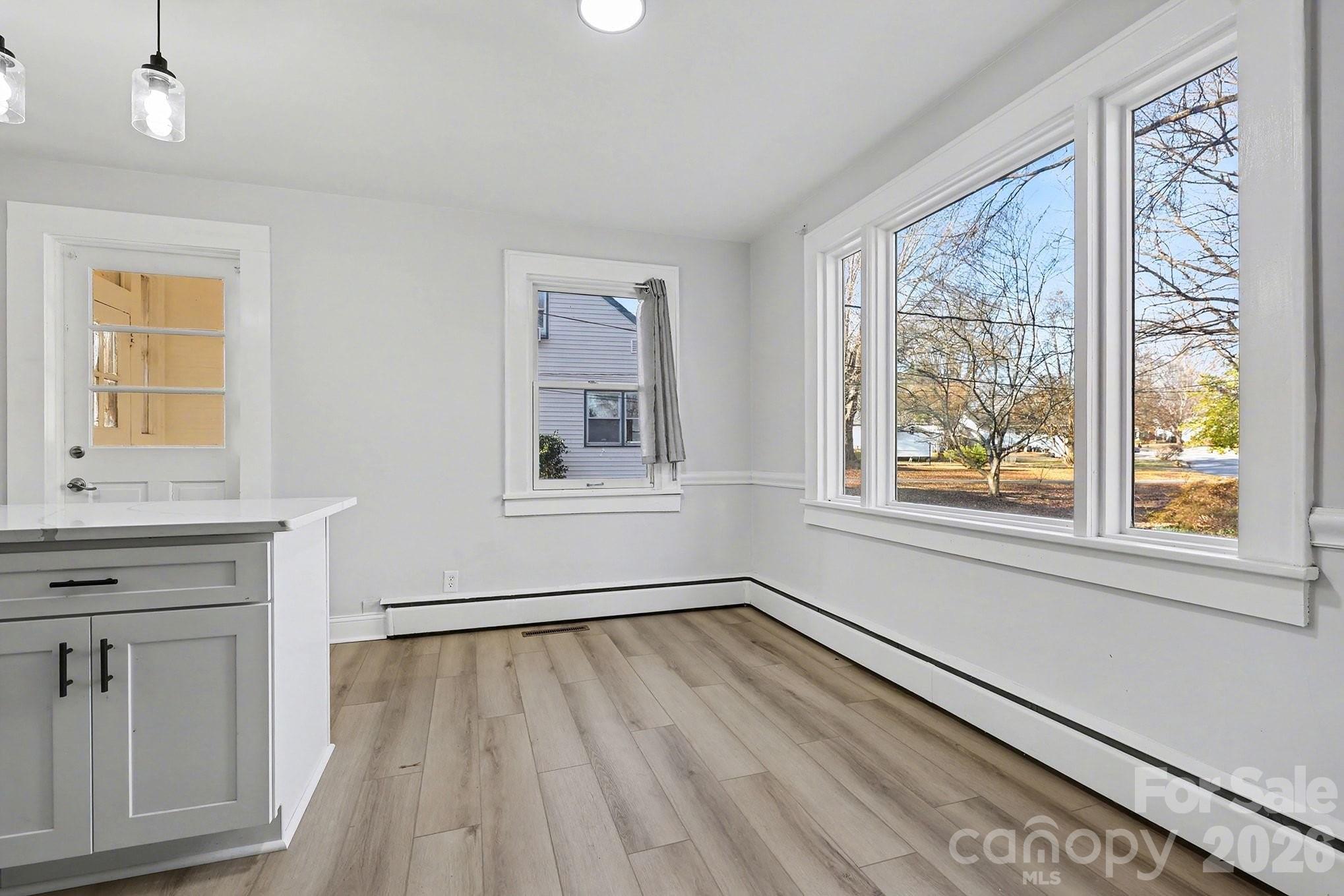 225 Valleyview Place Salisbury, NC 28144 - Photo 7 of 36 a view of a livingroom with wooden floor and a window
