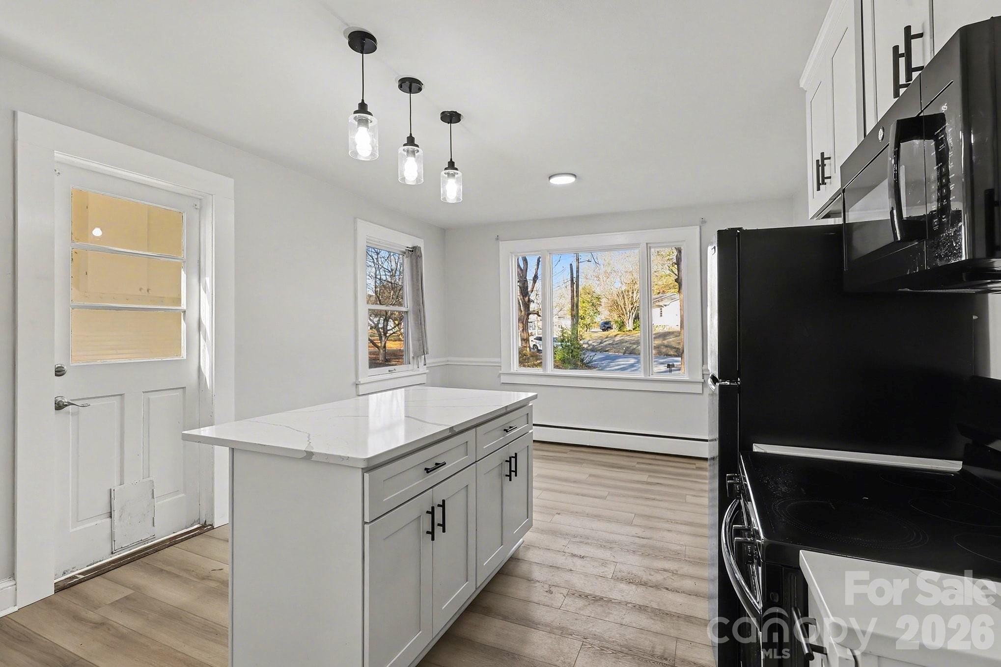 225 Valleyview Place Salisbury, NC 28144 - Photo 10 of 36 a kitchen with stainless steel appliances granite countertop a refrigerator and a stove