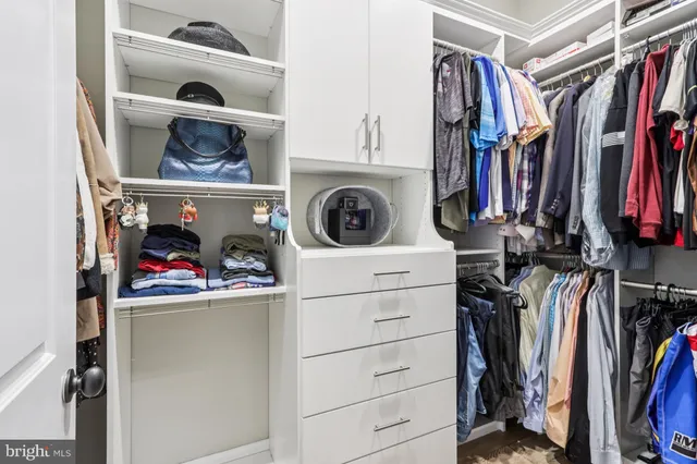 a spacious bathroom with a shower sink and mirror