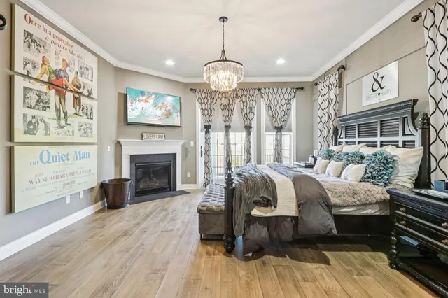 a very nice looking room with many windows and furniture