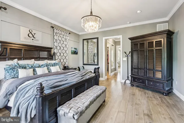a bedroom with a bed furniture and a book shelf