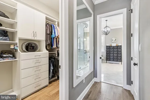 a en suite bathroom with a sink double vanity and a mirror