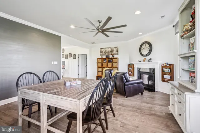 a view of walk in closet with clothes