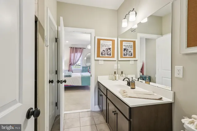 a kitchen with stainless steel appliances granite countertop a table chairs and a stove