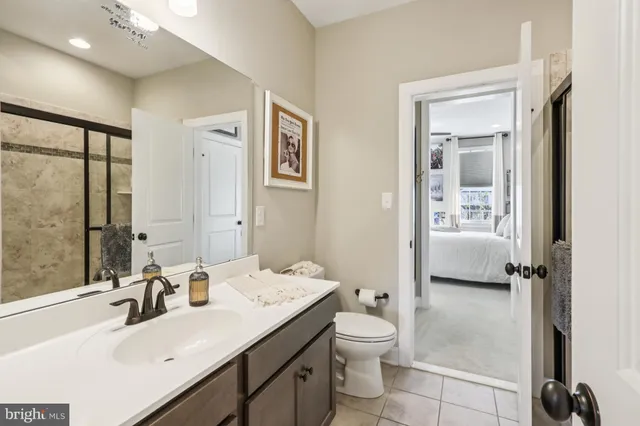 a living room with furniture a table and a pool table