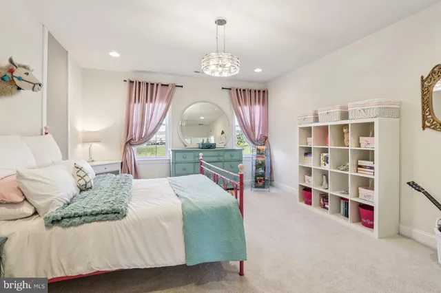 a spacious bedroom with double bed and a flat screen tv