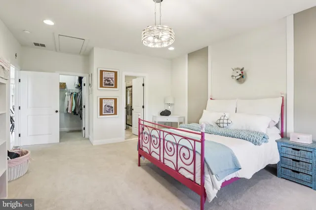 a kitchen with stainless steel appliances granite countertop a sink and a refrigerator