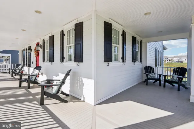 a view of an entryway with wooden floor and stairs