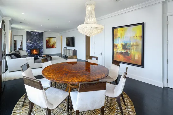 a dining room with furniture a window and wooden floor