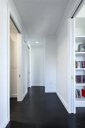 a view of livingroom with hardwood floor and a book shelf