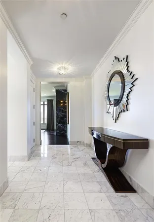 a view of a room with a table and chairs