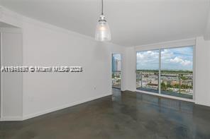 1688 West Avenue, Unit PH07 Miami Beach, FL 33139 - Photo 14 of 26 an empty room with wooden floor and windows