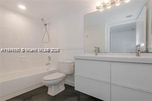 1688 West Avenue, Unit PH07 Miami Beach, FL 33139 - Photo 17 of 26 a bathroom with a sink a toilet and a bathtub