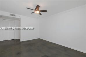 1688 West Avenue, Unit PH07 Miami Beach, FL 33139 - Photo 19 of 26 a view of a room with racks on the wall