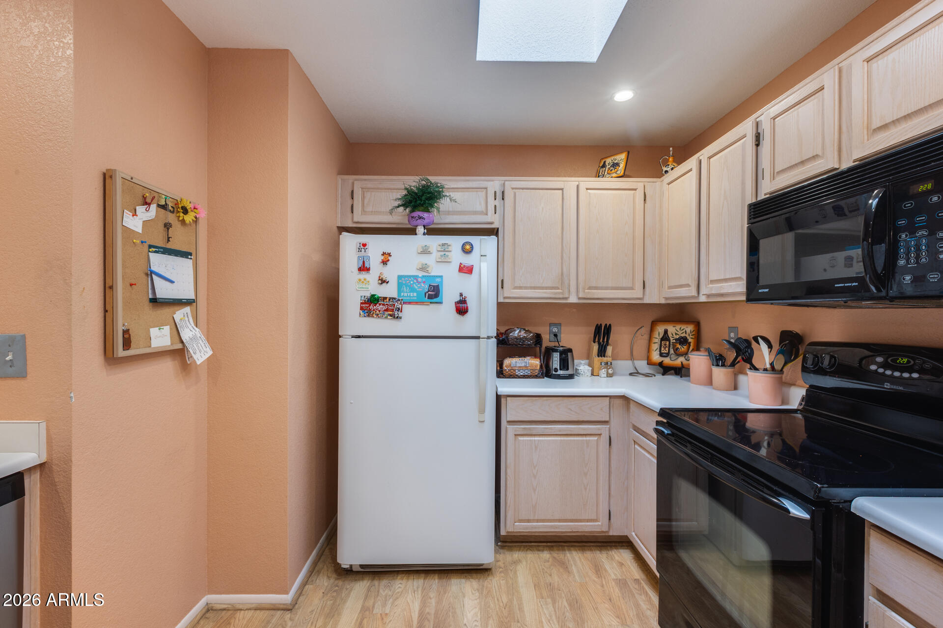 14300 West Bell Road, Unit 482 Surprise, AZ 85374 - Photo 11 of 53 a kitchen with a refrigerator stove and sink