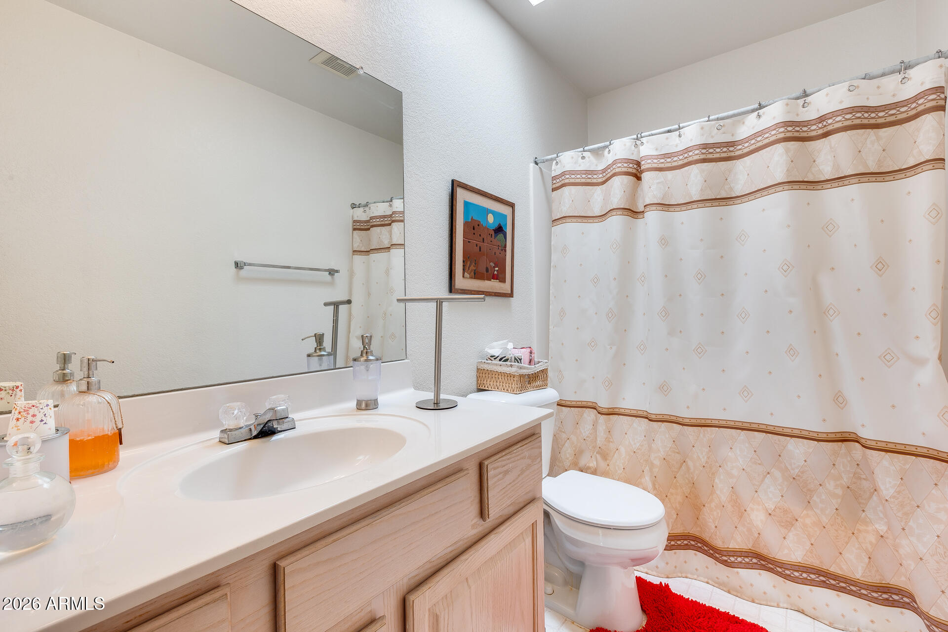 14300 West Bell Road, Unit 482 Surprise, AZ 85374 - Photo 21 of 53 a bathroom with a sink and a mirror
