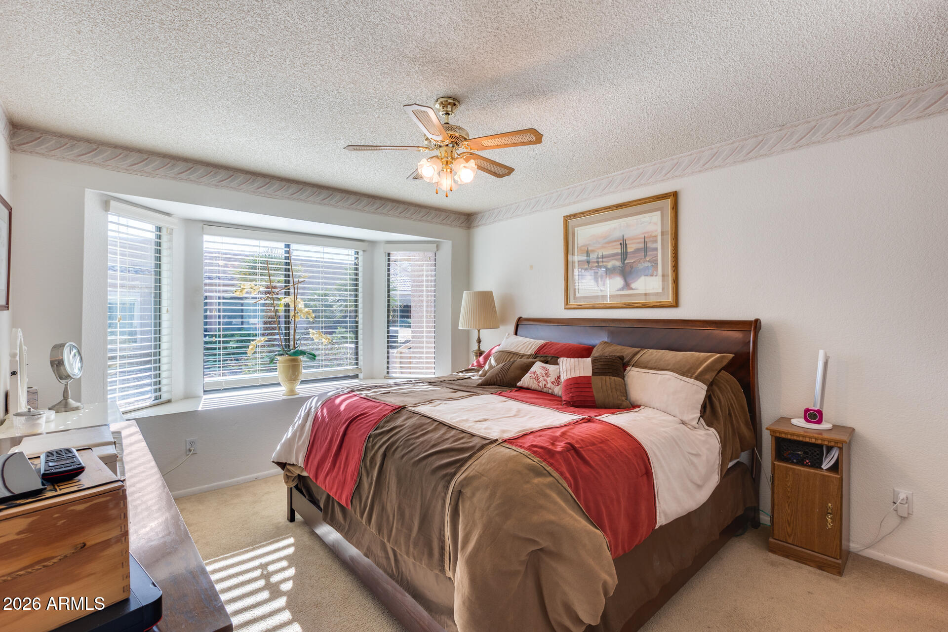 14300 West Bell Road, Unit 482 Surprise, AZ 85374 - Photo 22 of 53 a bedroom with bed and a large window