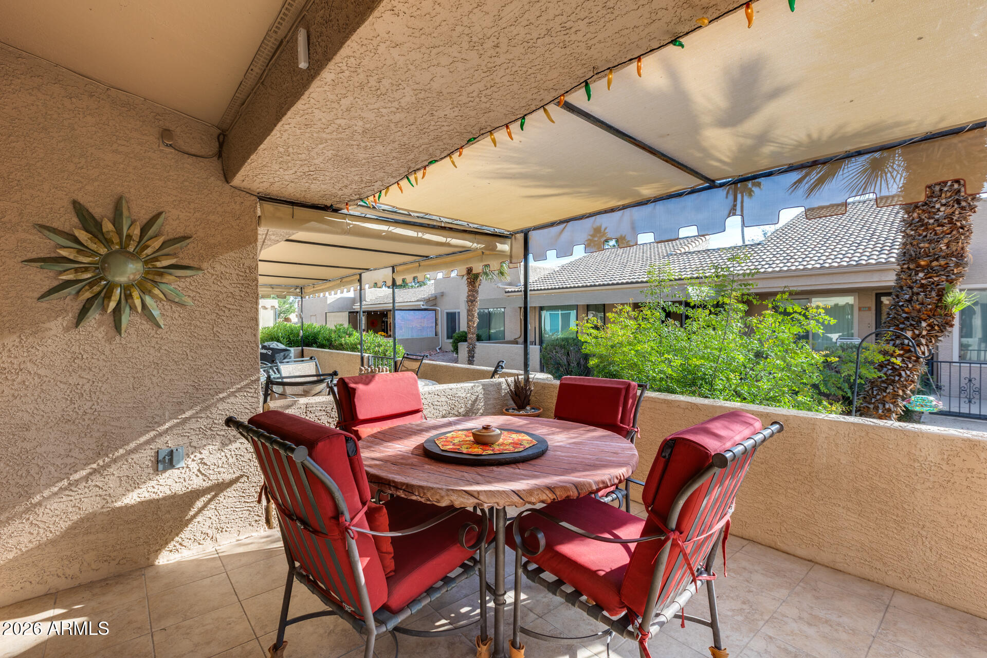 14300 West Bell Road, Unit 482 Surprise, AZ 85374 - Photo 27 of 53 a view of an outdoor dining space with a table and chairs