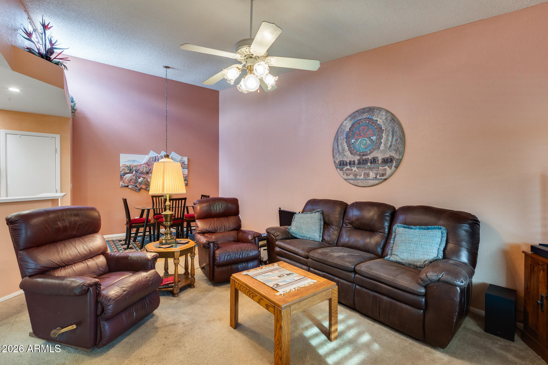 14300 West Bell Road, Unit 482 Surprise, AZ 85374 - Photo 6 of 53 a living room with furniture and a chandelier
