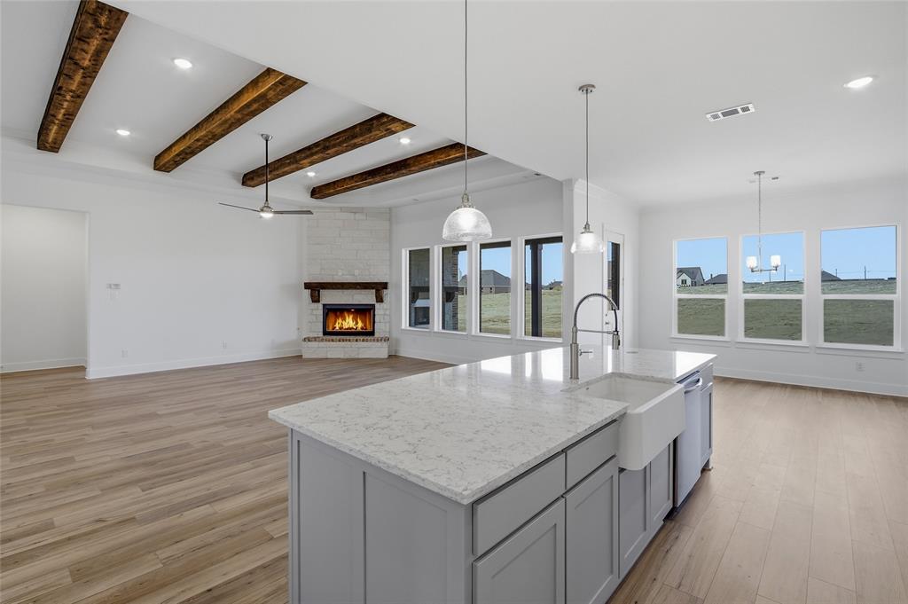 808 Vly Rdg Road Van Alstyne, TX 75495 - Photo 15 of 39 an open kitchen with a table and chairs in it