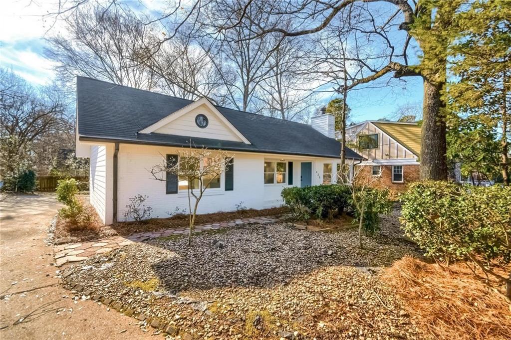 a house with trees in the background