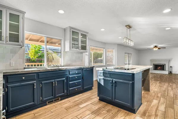 a kitchen with stainless steel appliances granite countertop a stove and a sink