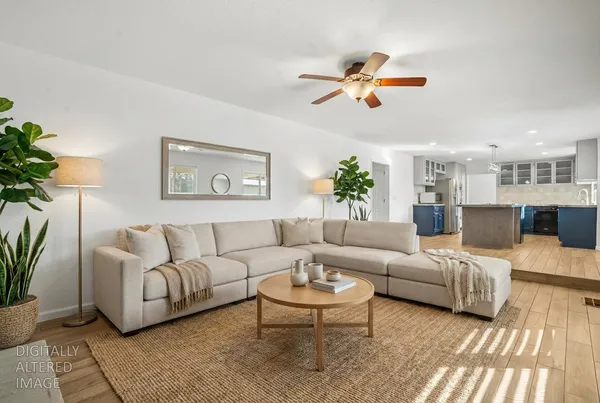a view of a hallway with entryway wooden floor and front door