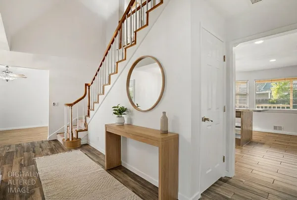 a bathroom with a granite countertop sink a toilet and a mirror