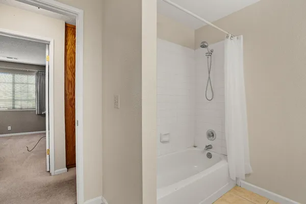 a view of an empty room with a window