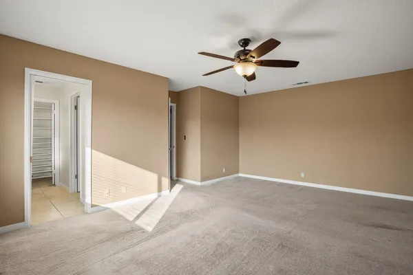 a front view of a house with a yard table and chairs