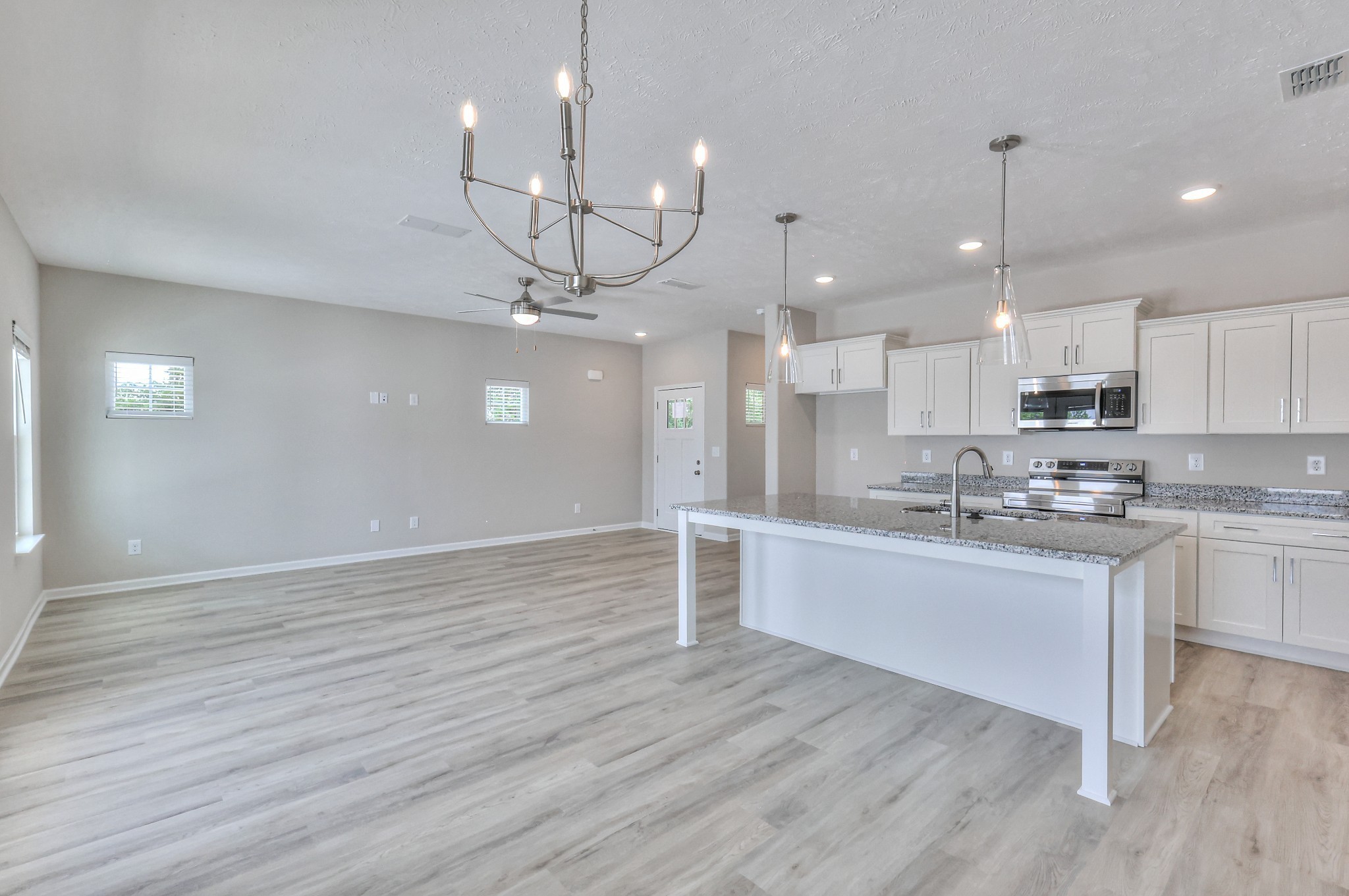 35 Hardwood Road Normandy, TN 37360 - Photo 10 of 29 a large kitchen with kitchen island a island a sink wooden floor and stainless steel appliances