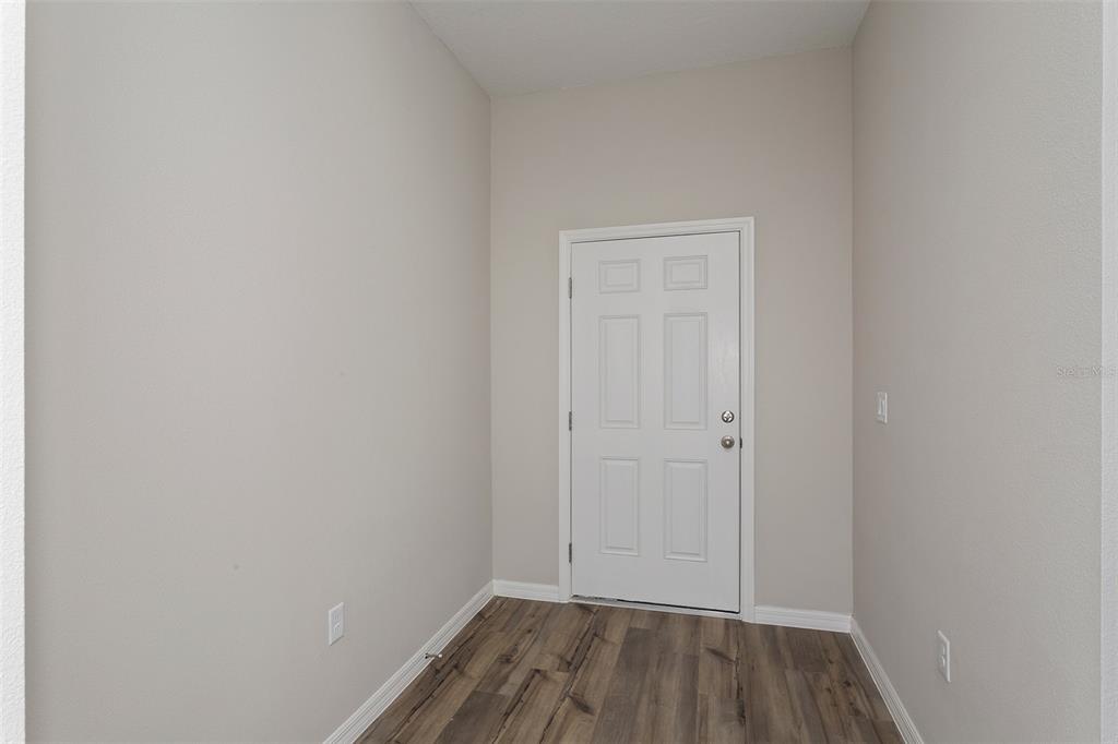 5848 Heaven Road Haines City, FL 33844 - Photo 15 of 35 a view of room with hardwood floor