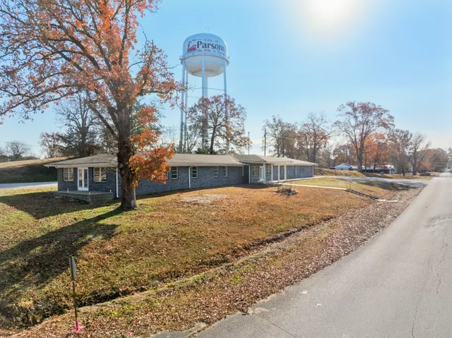 a view of a house with snow on the background