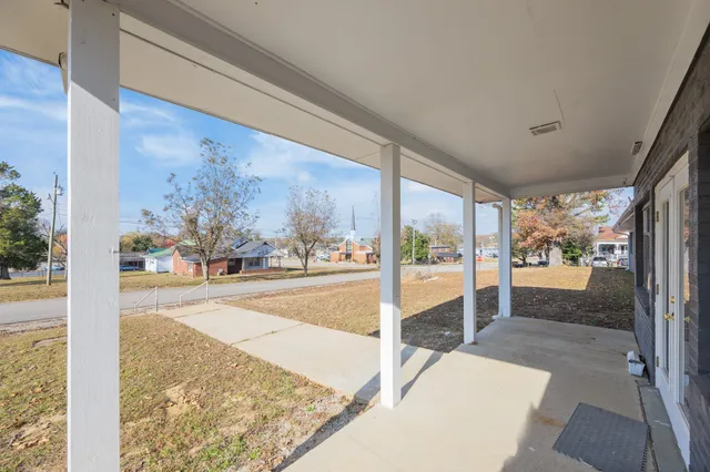 a view of a floor to room with wooden floor and a floor to ceiling window