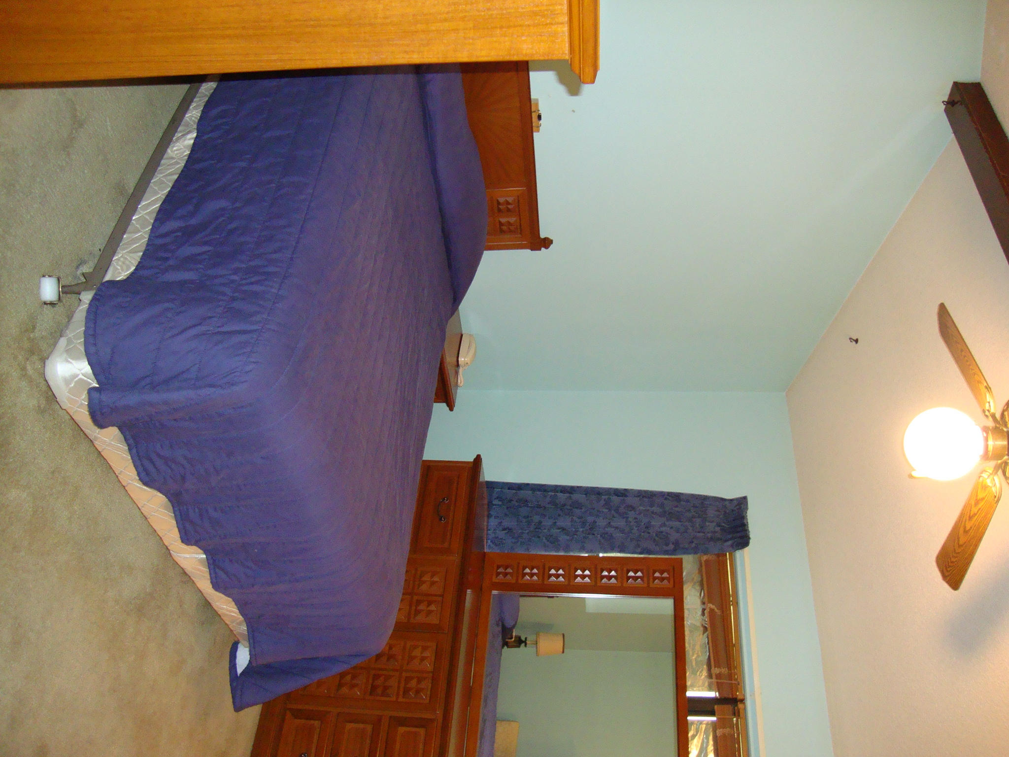 312 Riley Road Niceville, FL 32578 - Photo 10 of 21 a bedroom with a bed and a mirror