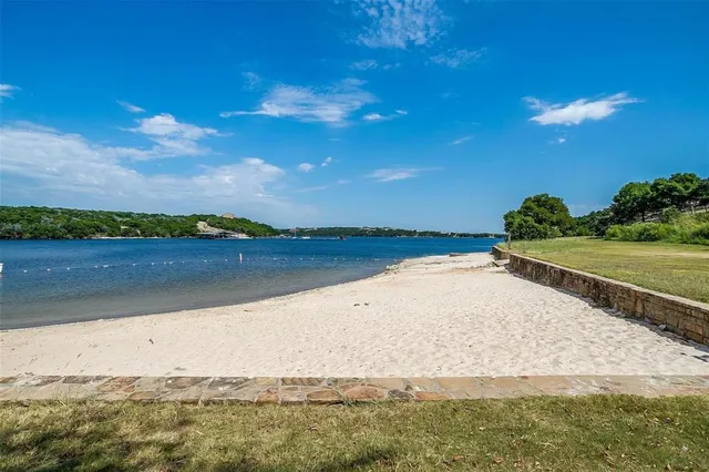 a view of an ocean beach and a yard
