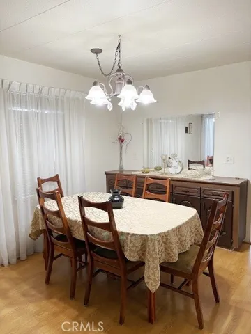 a kitchen with a dining table and chairs