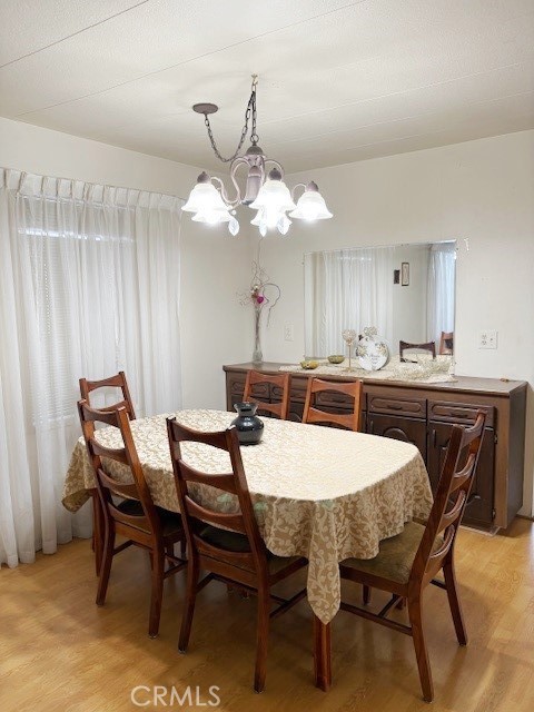 14851 Jeffrey Road, Unit 241 Irvine, CA 92618 - Photo 2 of 7 a kitchen with a dining table and chairs