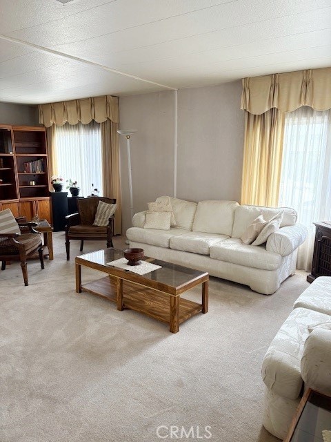 14851 Jeffrey Road, Unit 241 Irvine, CA 92618 - Photo 3 of 7 a living room with furniture and a large window