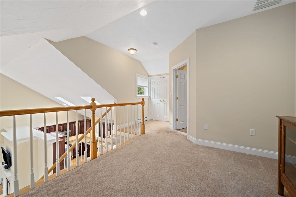 14 Sugar Maple Circle, Unit 14 Hanover, MA 02339 - Photo 22 of 38 a view of an empty room with stairs