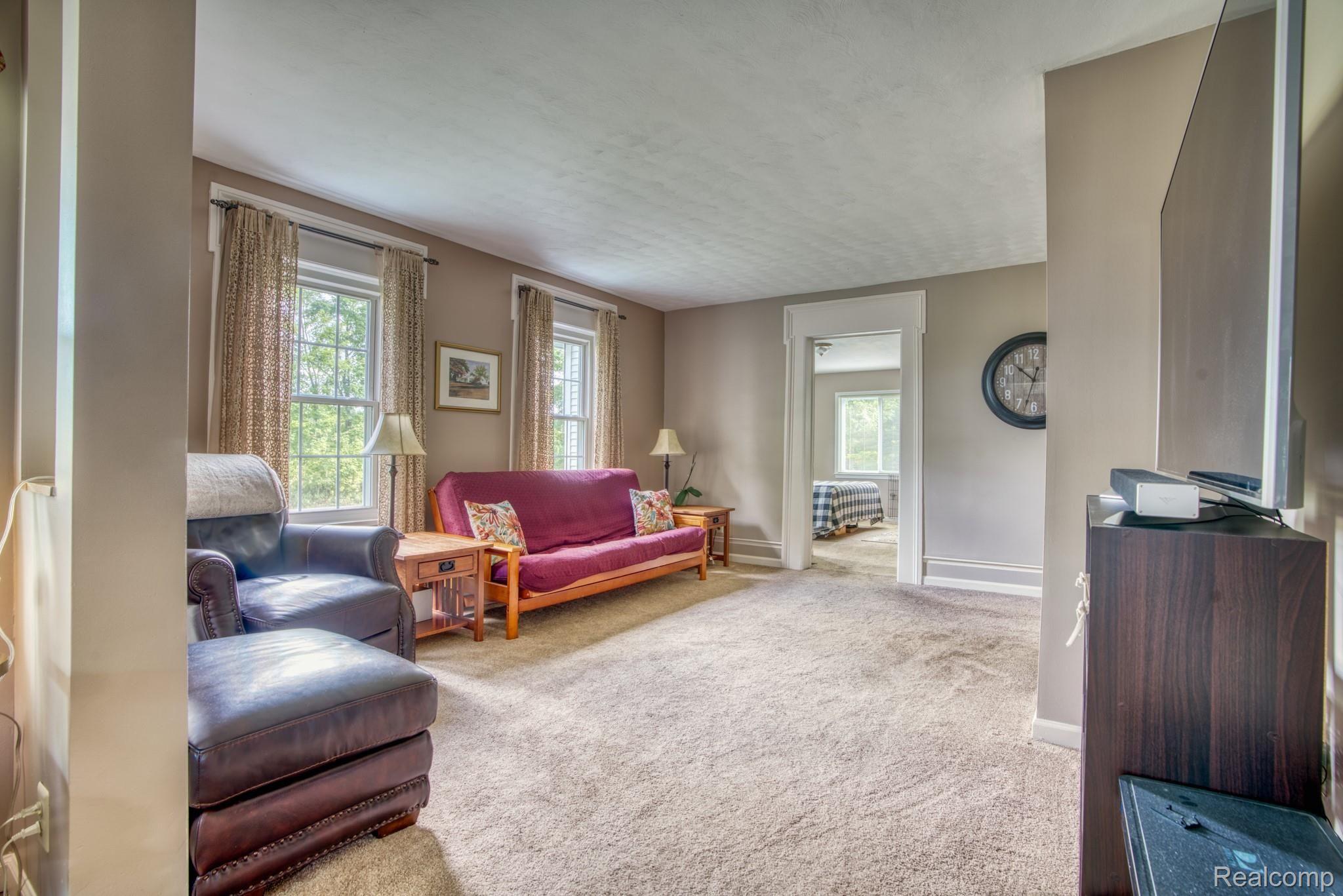 4065 Jewell Road Howell, MI 48843 - Photo 2 of 62 LIVING ROOM LOOKING INTO 1ST FLOOR MASTER