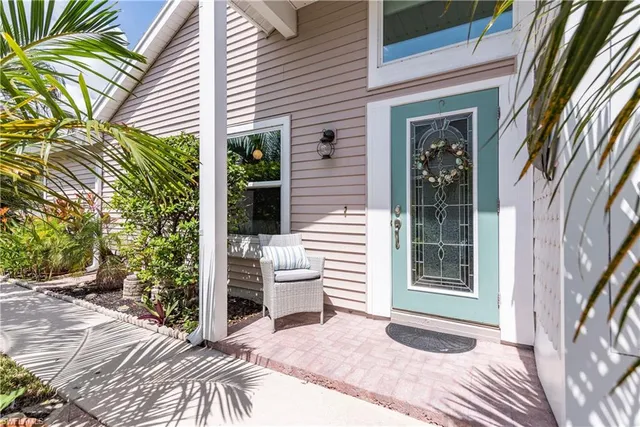 a view of a house with a yard and sitting area