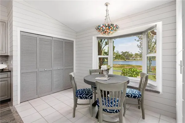 a view of a dining room with furniture window and outside view